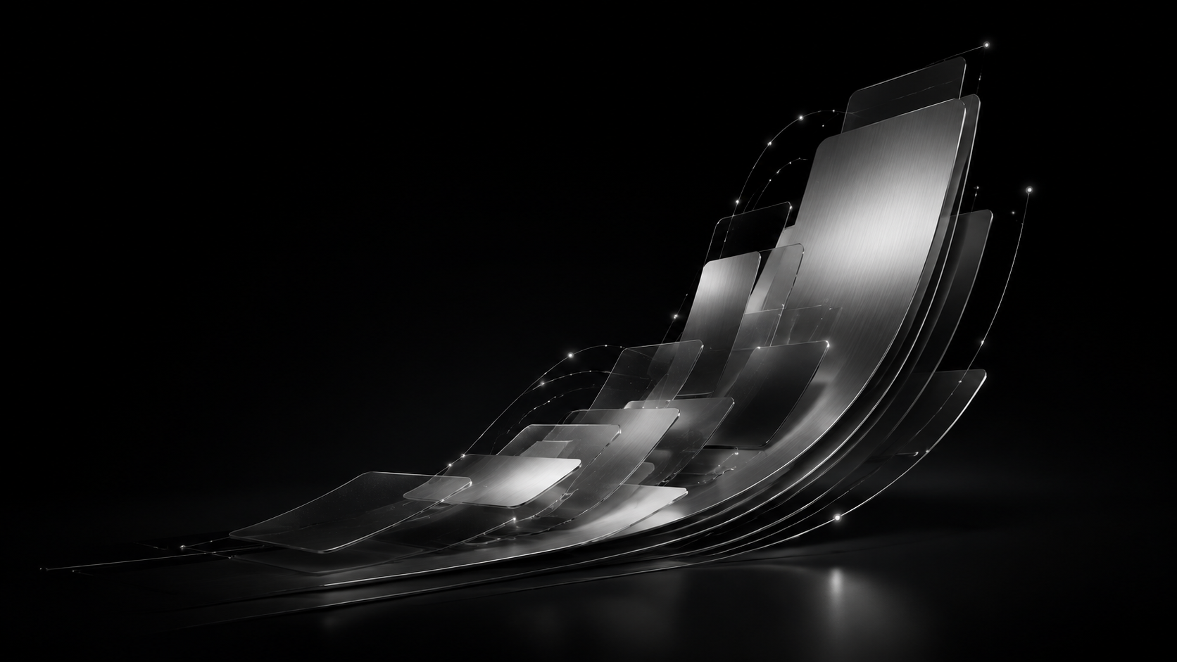 Abstract silver panels curving upward against a black background